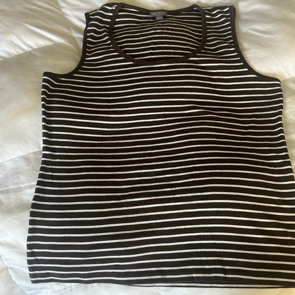 Sleeveless striped brown shirt gently used. No rips, holes, or stains.